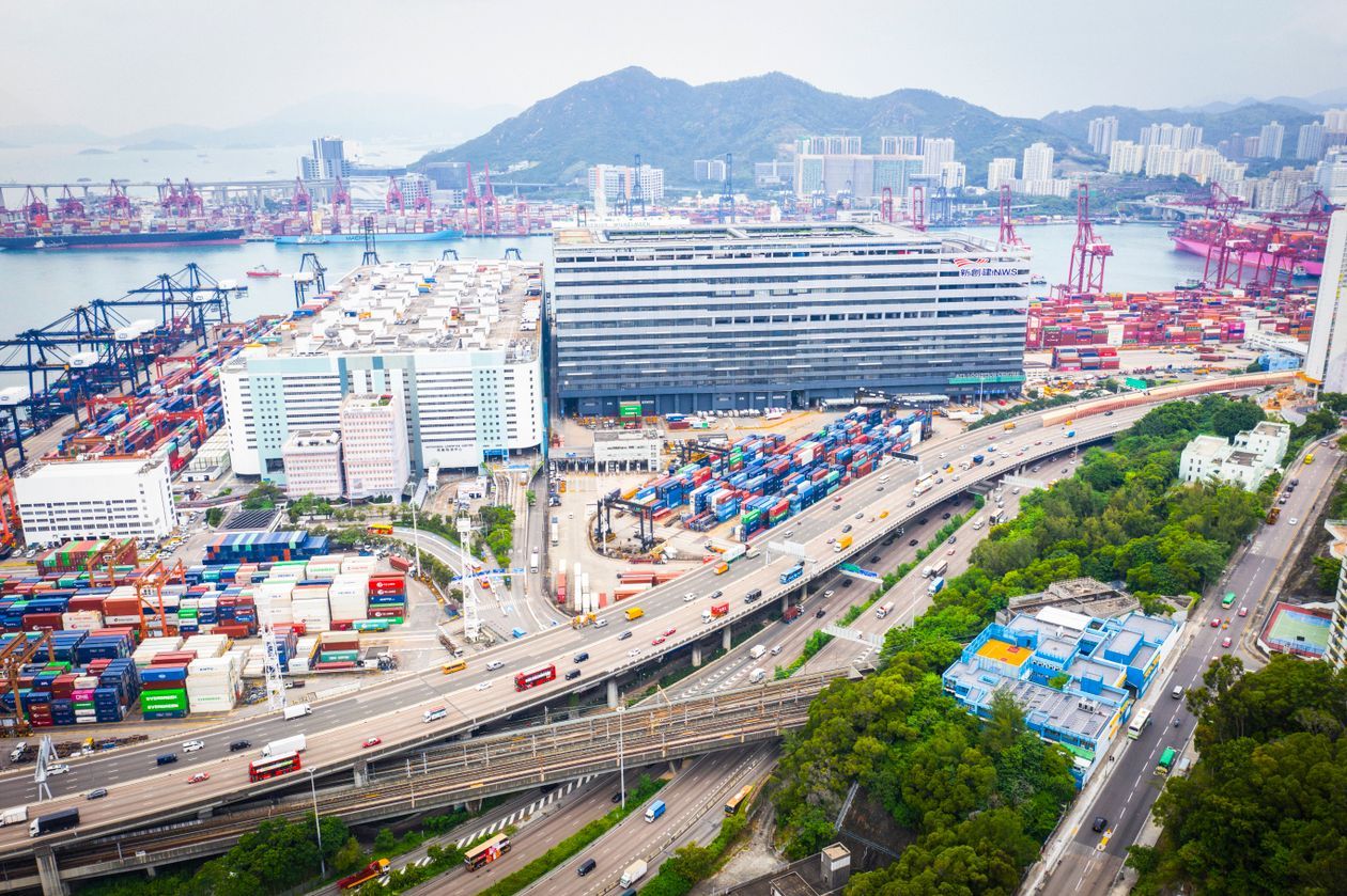 Aerial view of Hong Kong's Kwai Tsing container terminal, with stacked containers, port cranes and the highway trucks use to carry goods towards the mainland