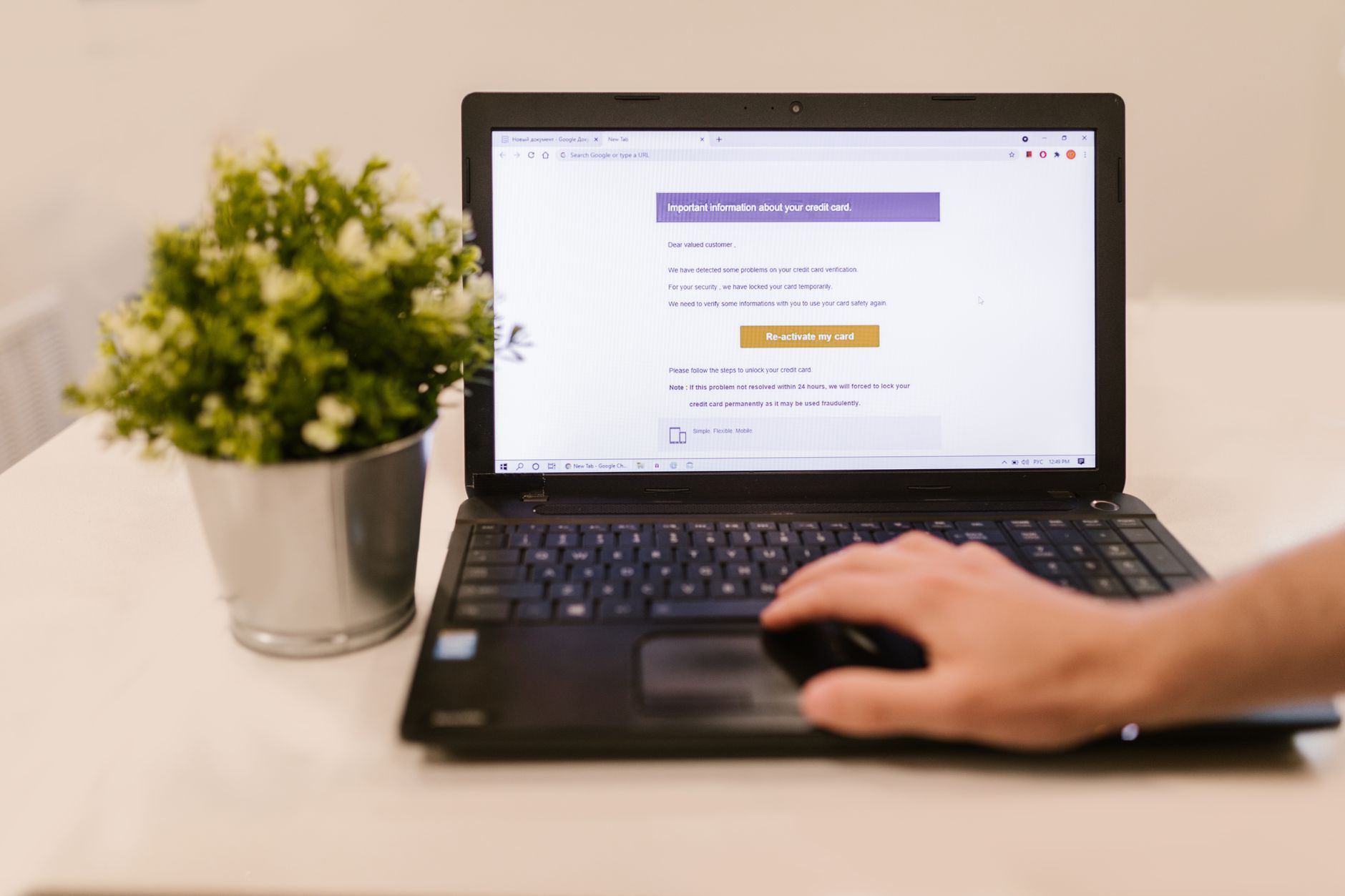 A person at a desk reading an email on a laptop screen, representing the moment a Singapore trading company's staff member opens what looks like an ordinary supplier invoice