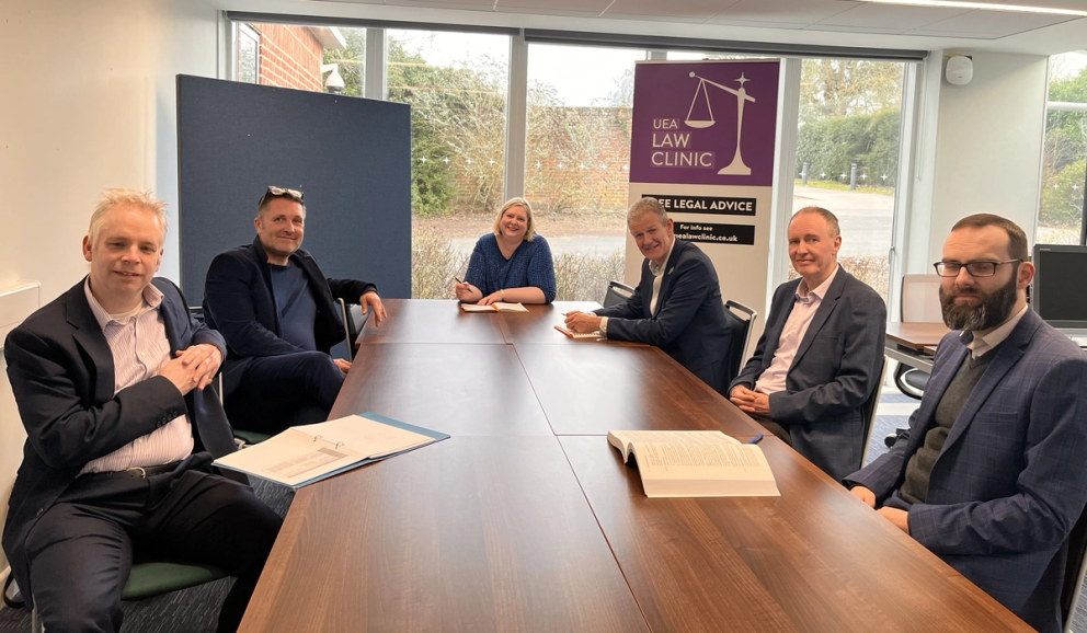 Image of the business clinic advisors sitting around a table
