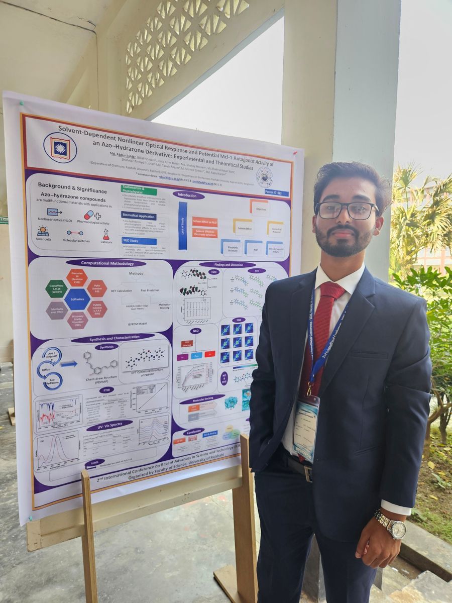 Shohag beside his nonlinear optics research poster