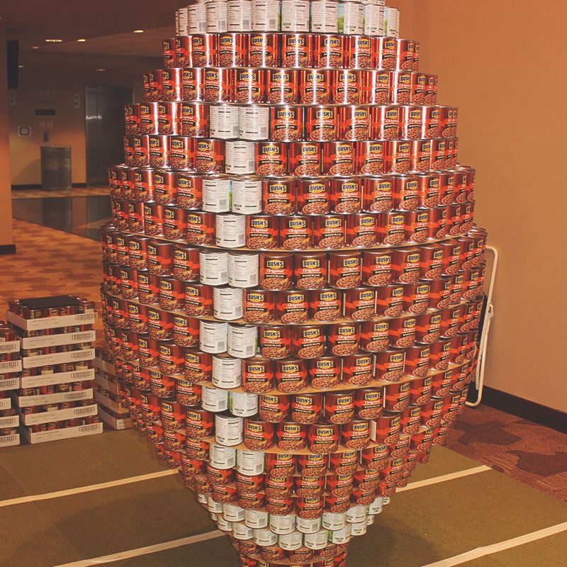 food donations arranged into a football