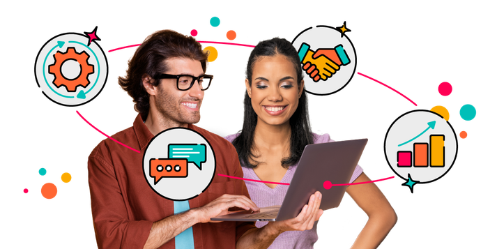 A man and a woman standing next to a laptop, surrounded by colourful icons