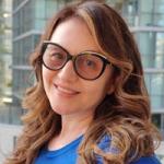 Headshot of Vali Gurgu in front of a building