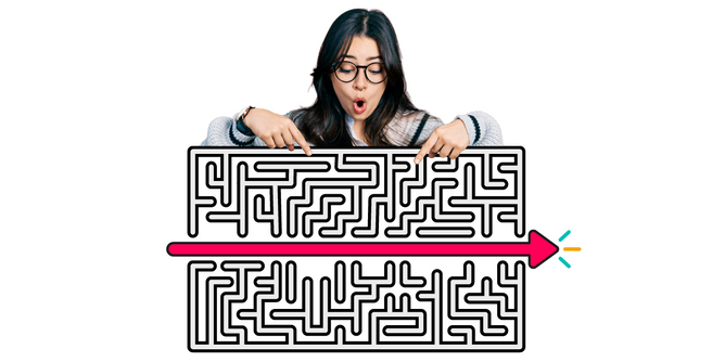A person looks down at a maze which has a bright pink arrow shooting through the centre