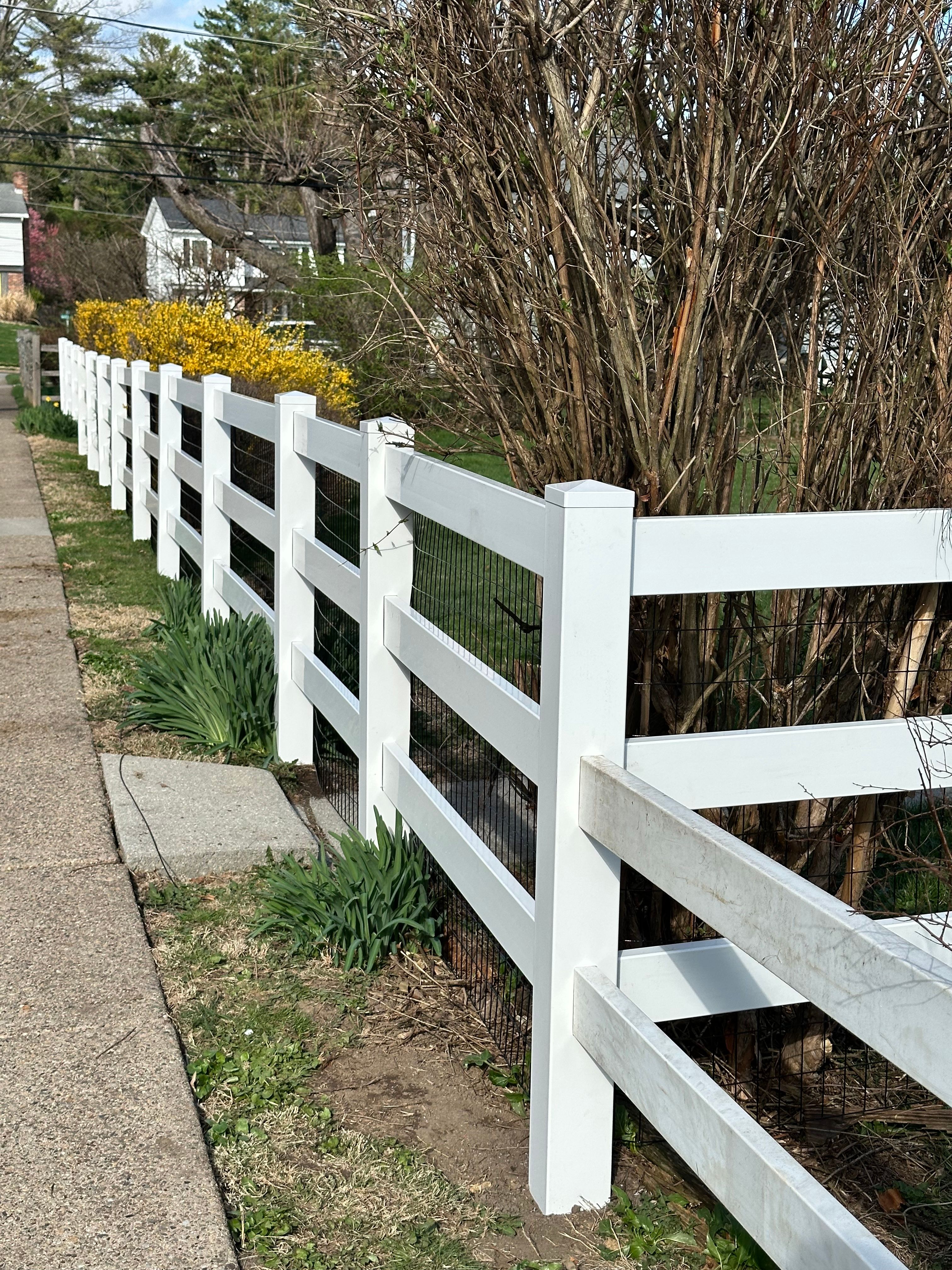 new 3 rail ranch style vinyl fence tying into existing 2 rail fence
