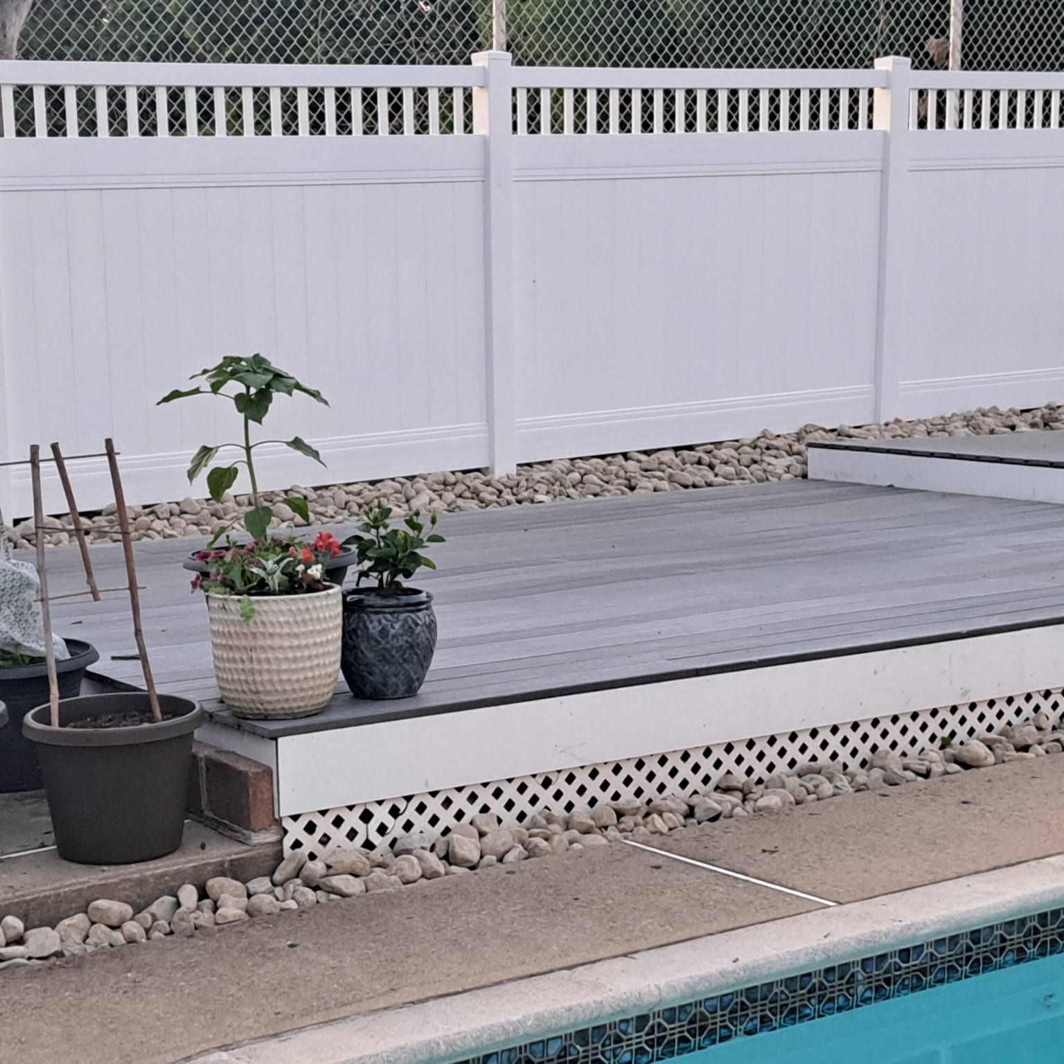 pool side fence with nice hardscaping