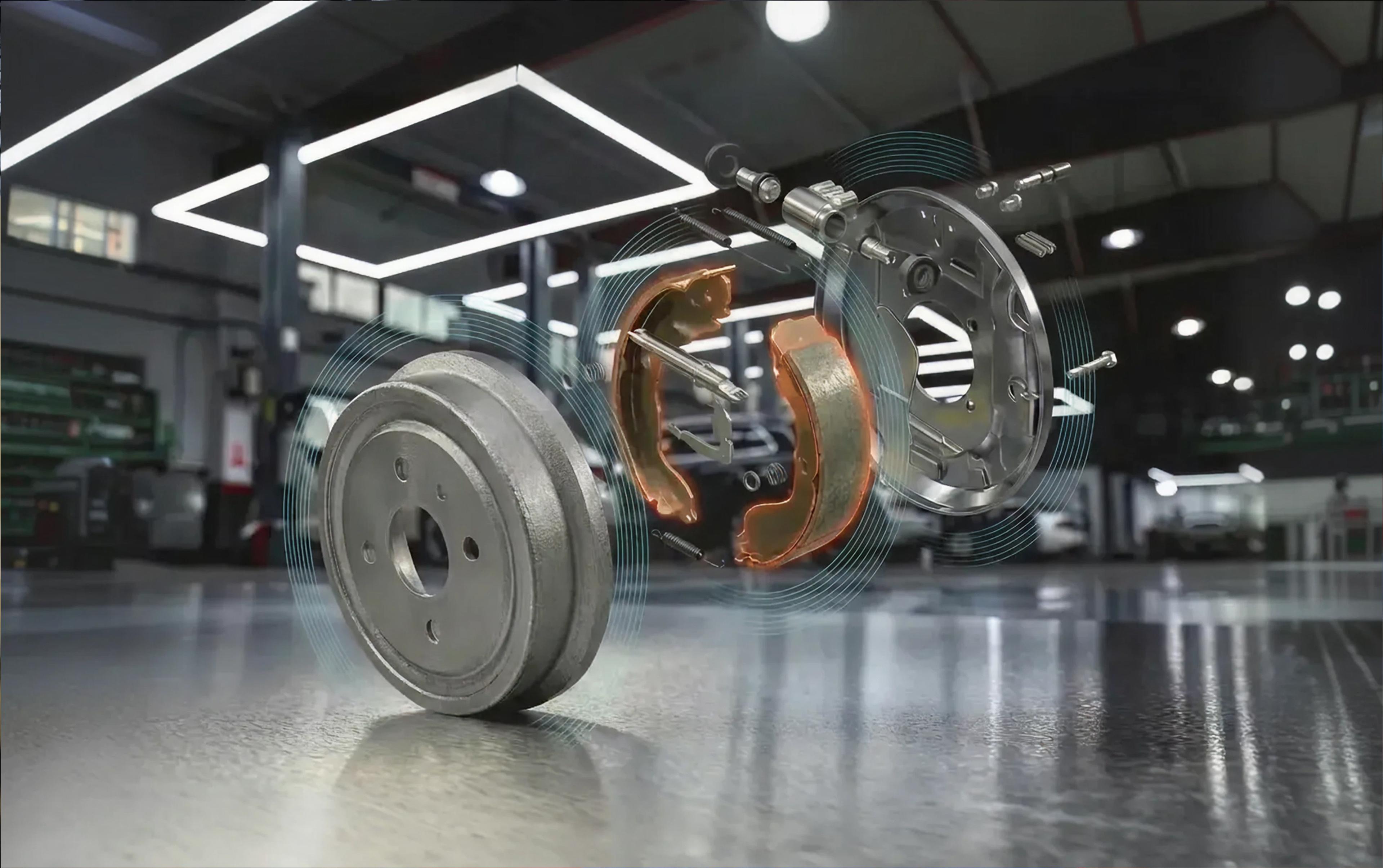 Exploded view of a drum brake with brake drum, brake shoes, and fastening elements in a workshop environment