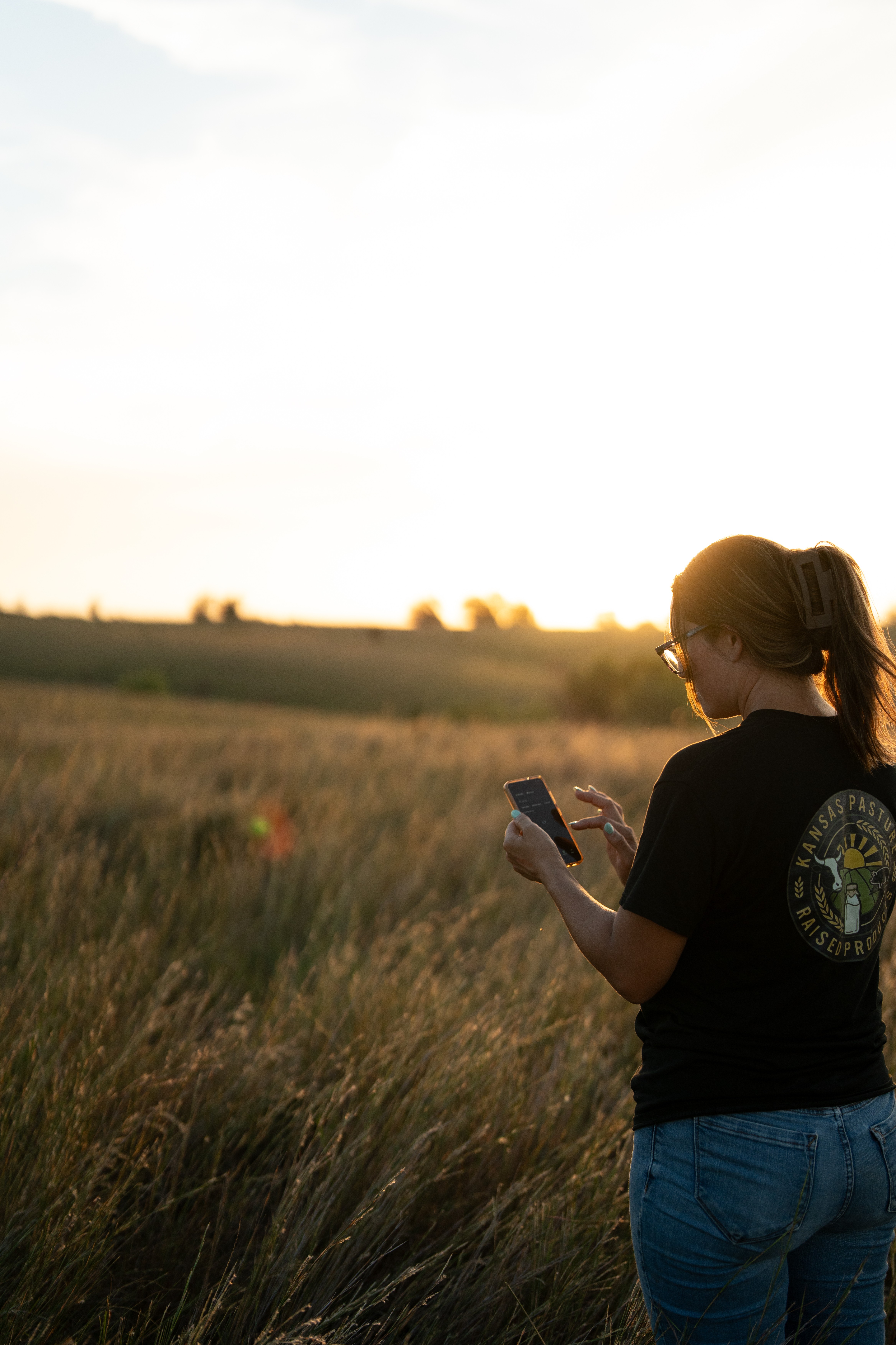 Rancher using monil app on her smartphone 