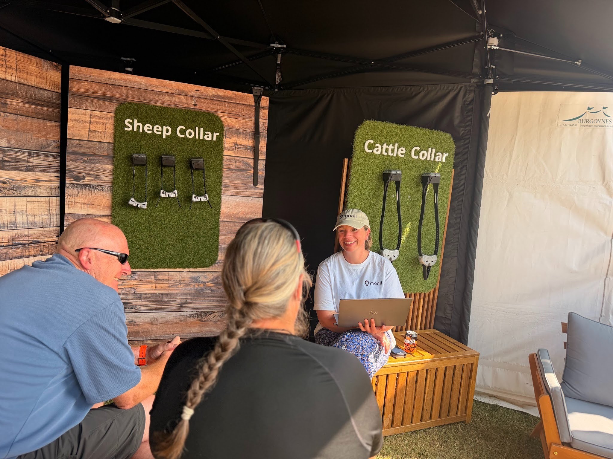 Head of Sales Sally speaking to people at a fair