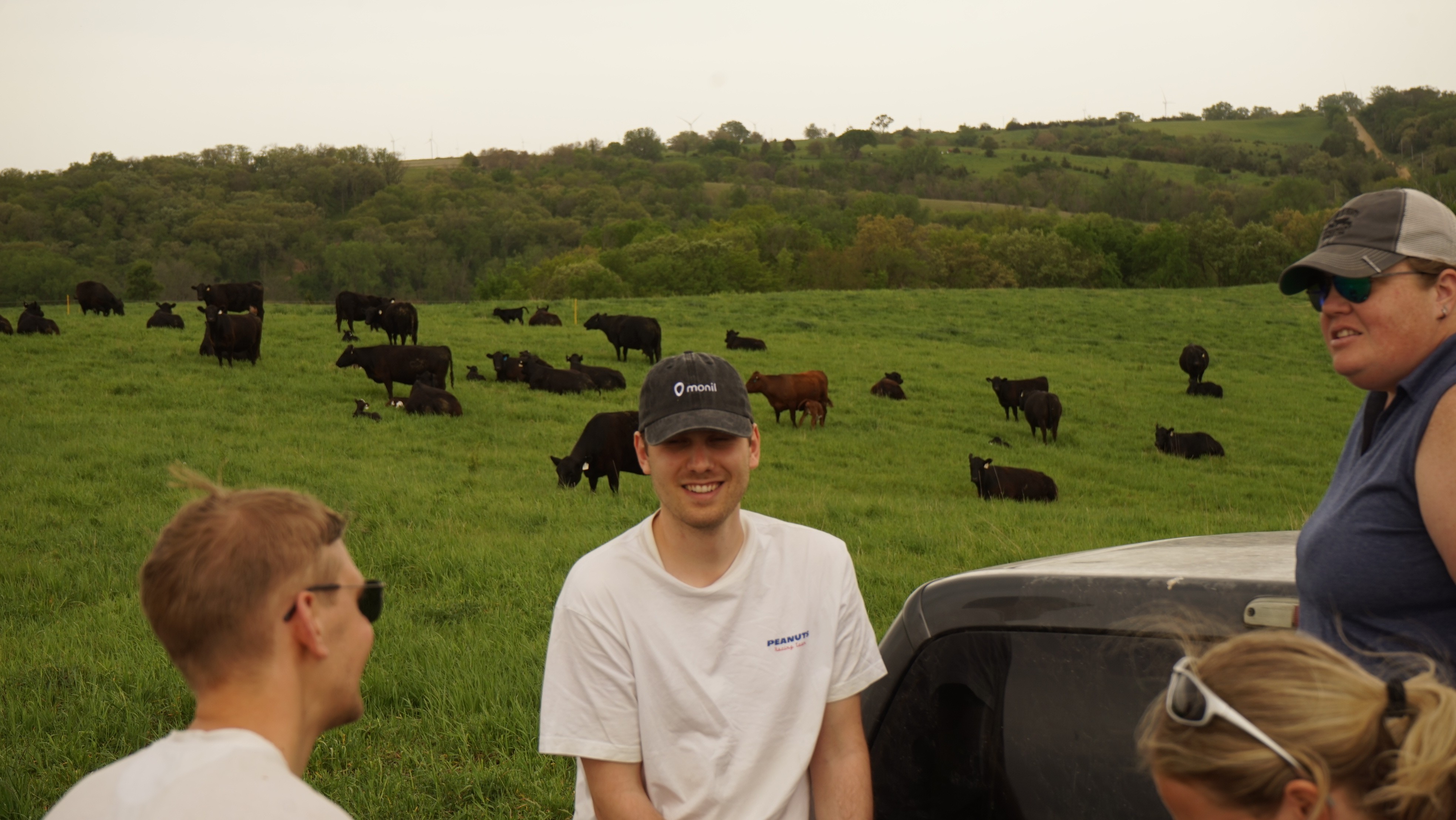 Monil employees at trade show. Join Monil webinars to learn about cattle GPS collars and virtual fencing. Designed for individuals interested in careers in livestock technology.
