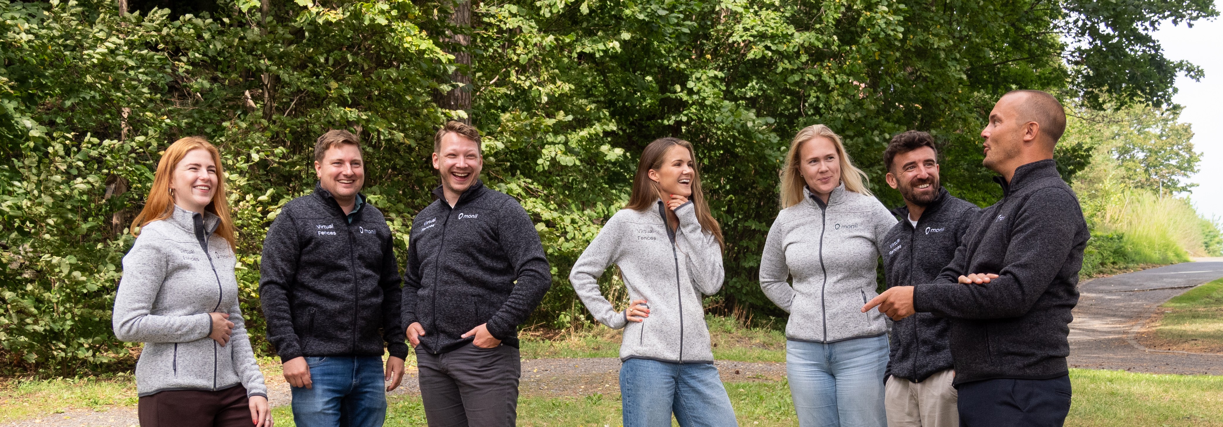 Family petting cow with Monil collar