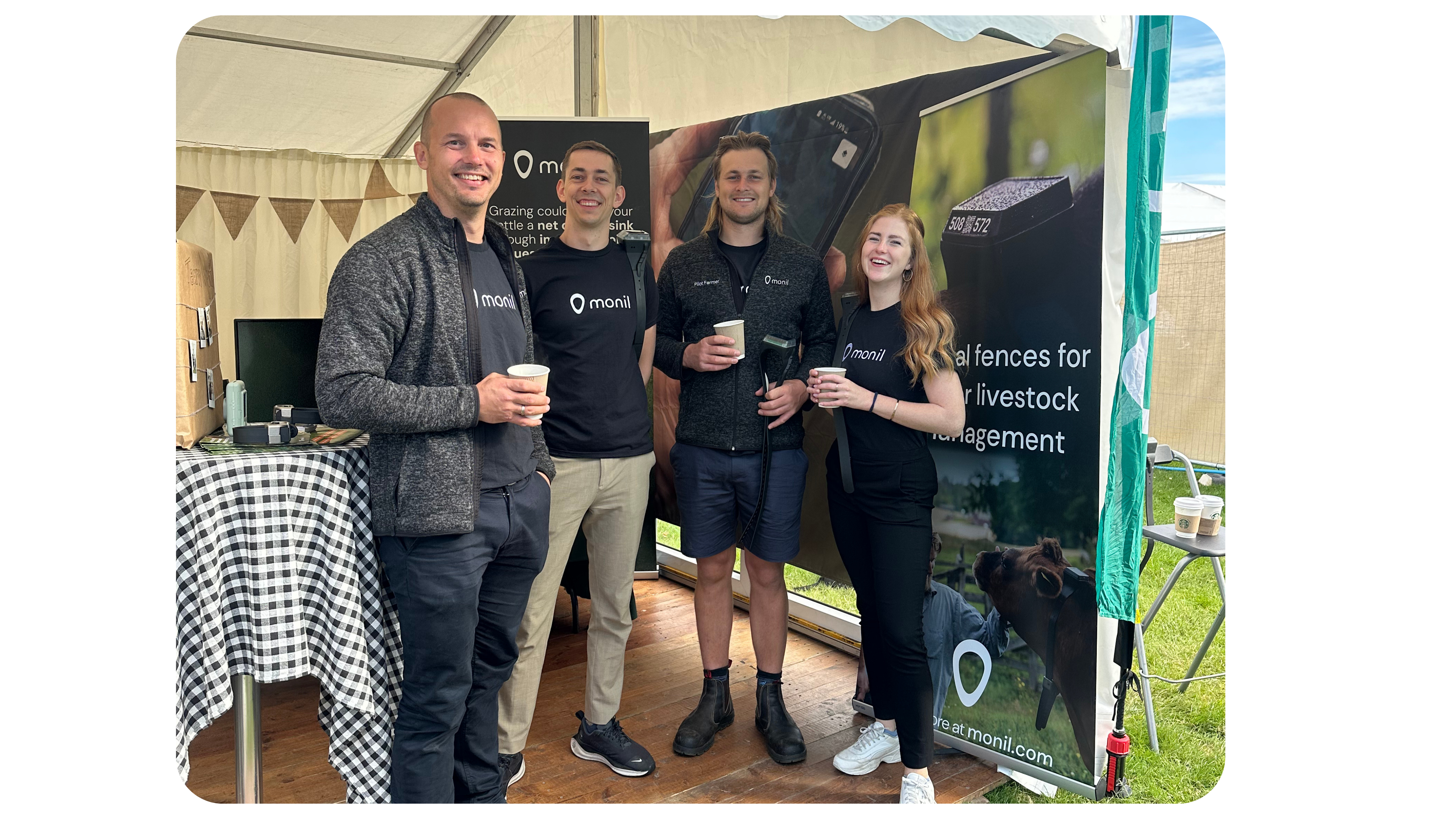 Monil employees at trade show. Join Monil webinars to learn about cattle GPS collars and virtual fencing. Designed for individuals interested in careers in livestock technology.