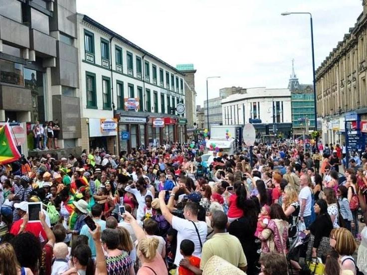 Huddersfield town centre packed with carnival-goers on Carnival day.