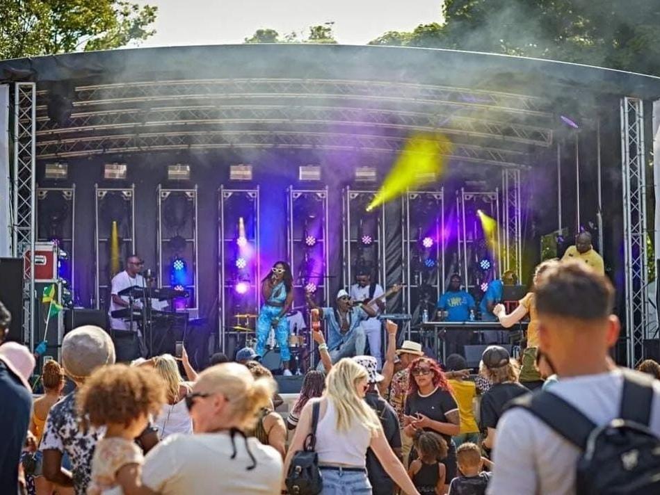 Main stage performance at Huddersfield Carnival with a packed crowd.