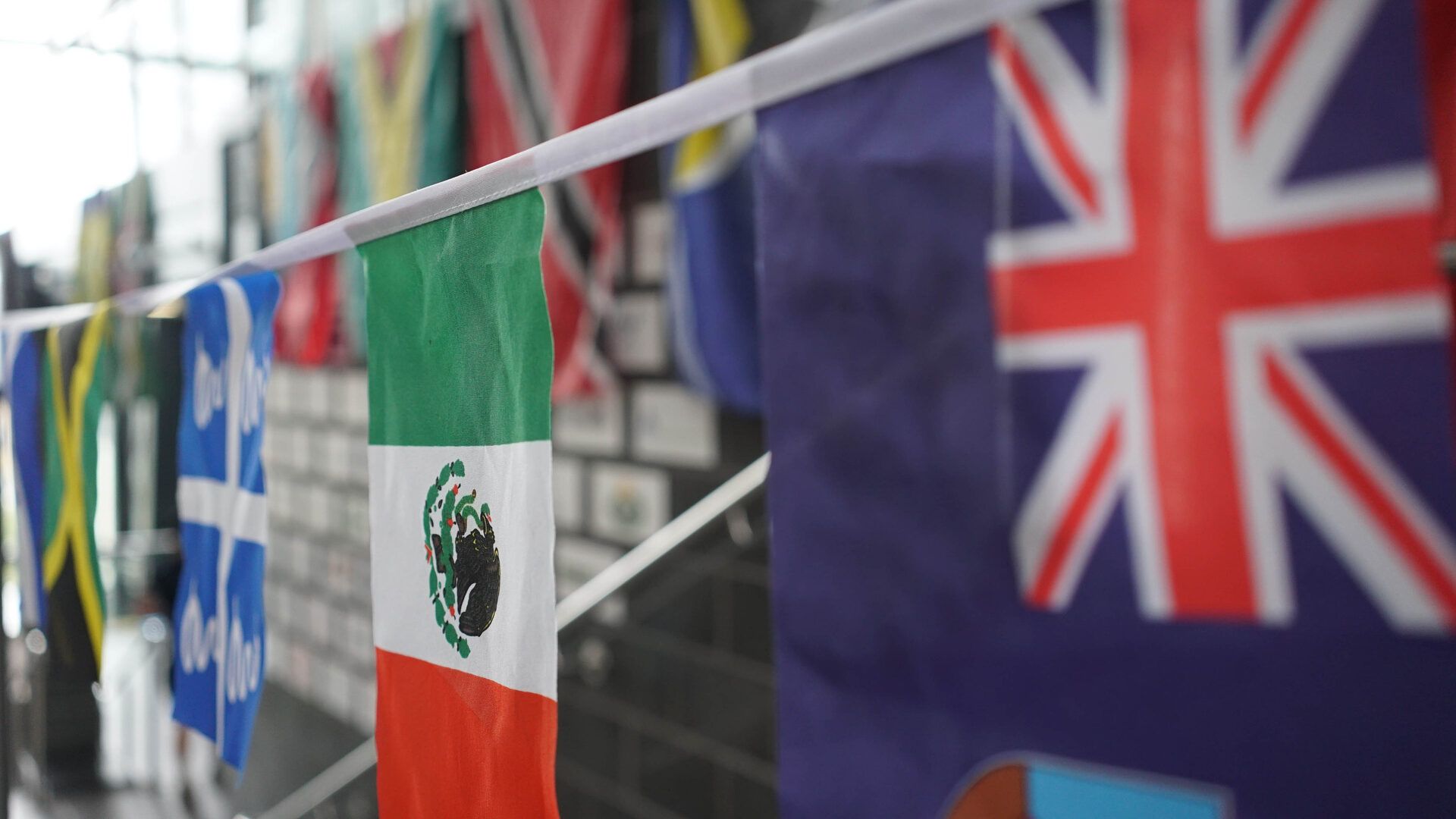 Bunting of Caribbean and international flags including Jamaica, Mexico and the Union Jack.