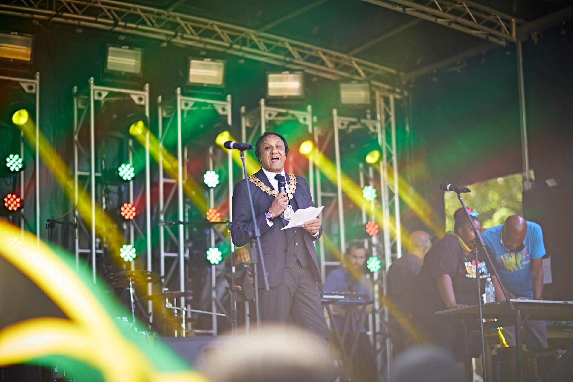 The Mayor of Kirklees speaking on stage at the carnival opening ceremony.