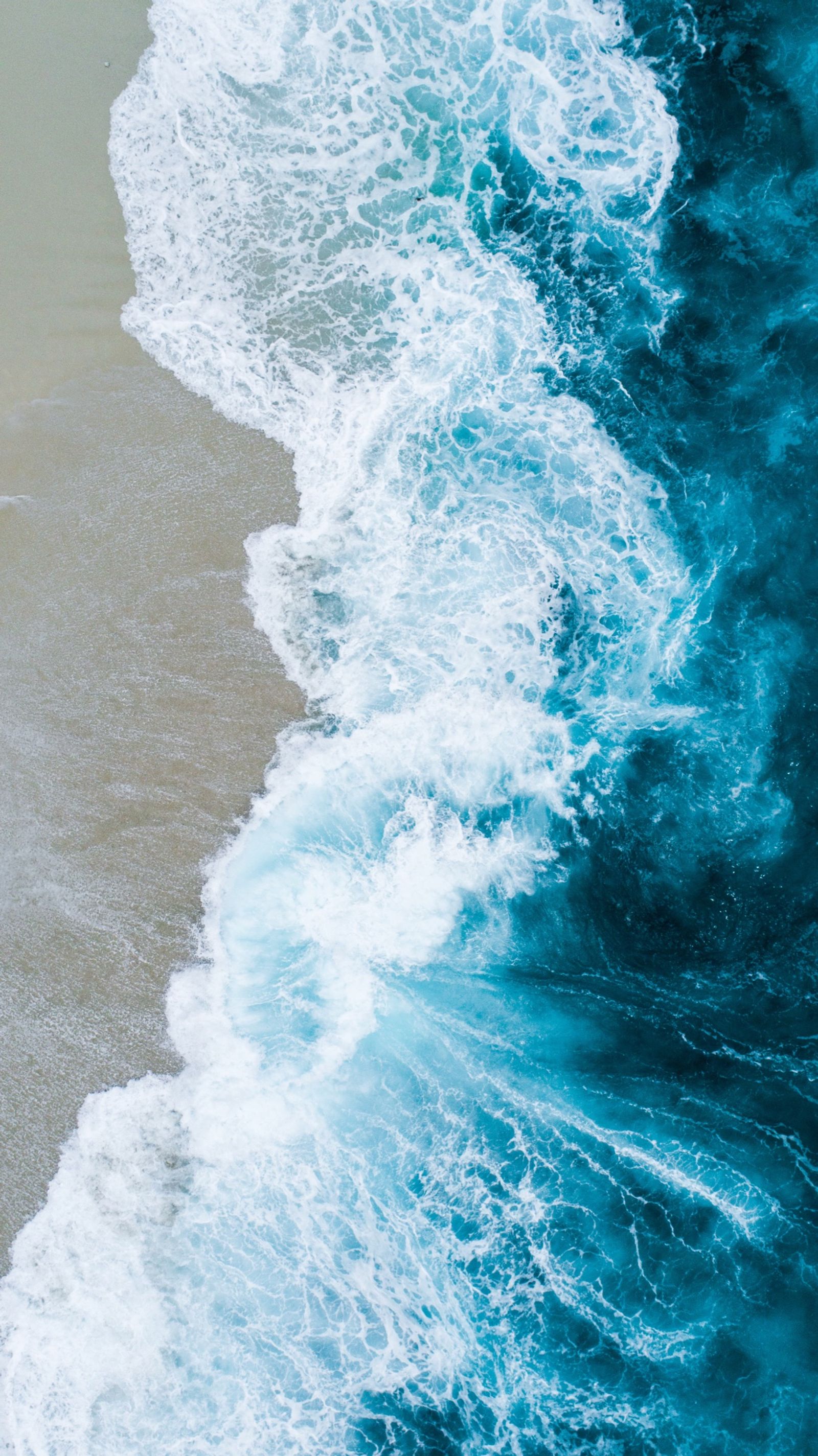 Turquoise ocean waves seen from above