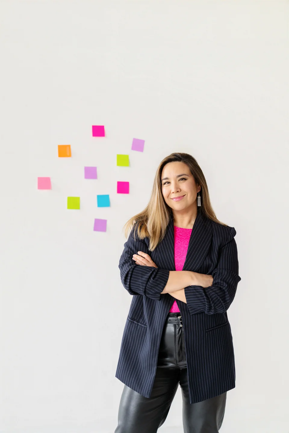 Nat Tubanos, Co-founder of ChocoBelly, smiling in a portrait headshot