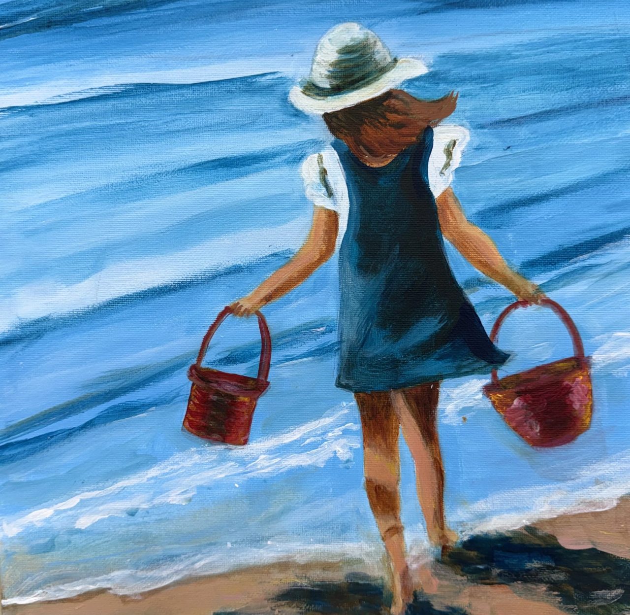 A girl in a sun hat and dark dress carrying two red baskets into the waves