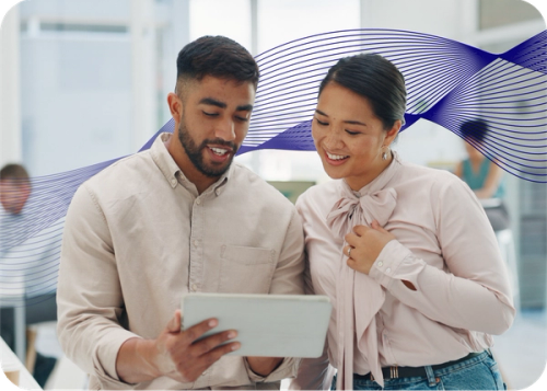 Two people looking at a screen with an AI data wave behind them