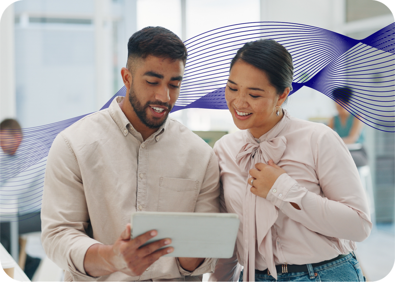 Two people looking at tablet in an office setting, blue wave in the background