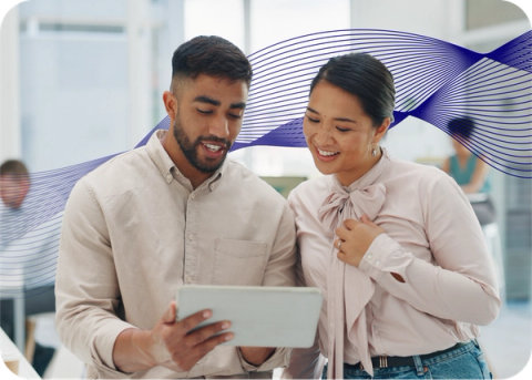 Two people looking at a screen with an AI data wave behind them