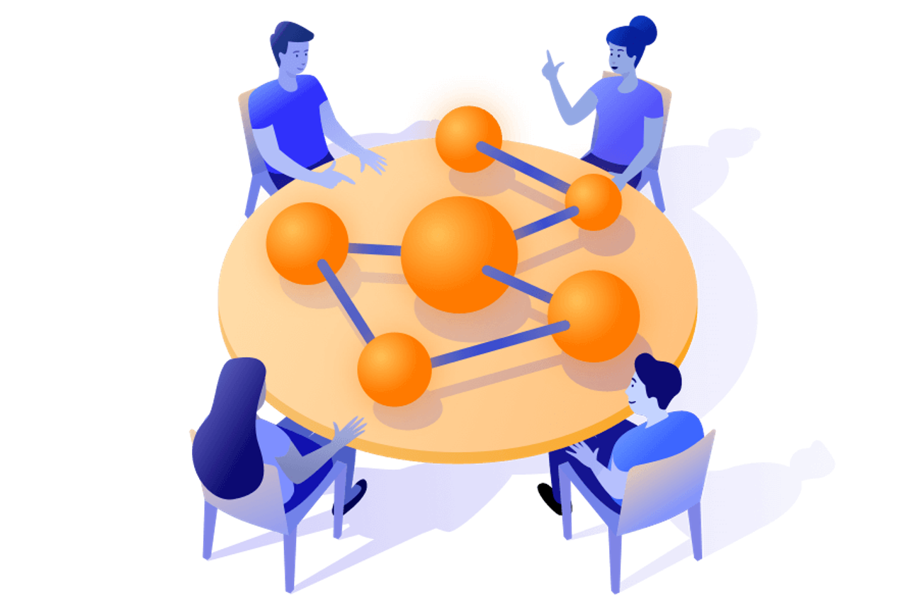 An isometric illustration of four people seated around a large round table, looking at a network diagram made of orange nodes connected by blue lines. The scene suggests a collaborative discussion about connections, data, or teamwork