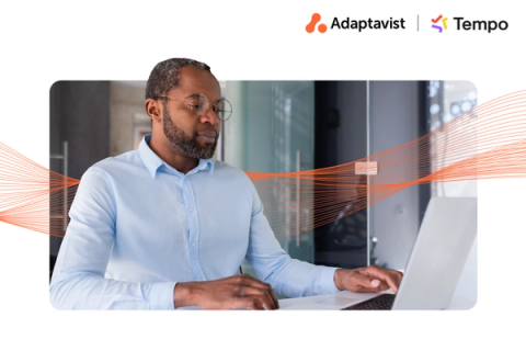 Person looking at a laptop screen with an orange AI wave behind them