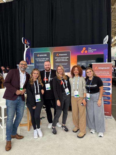 photograph of team members from The Adaptavist Group in front of their booth at Elevate '25 in NYC