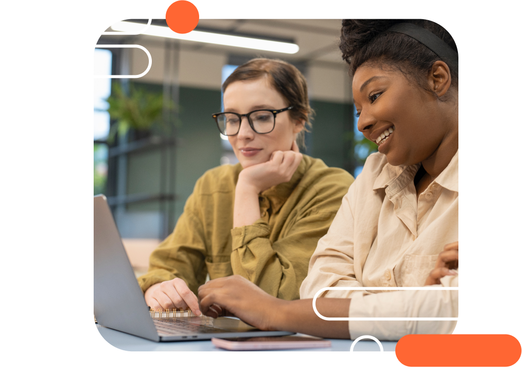 Two people looking at a laptop together