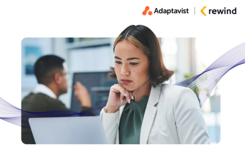 Person looking thoughtfully at a laptop screen with the Adaptavist and Rewind company logos in the background