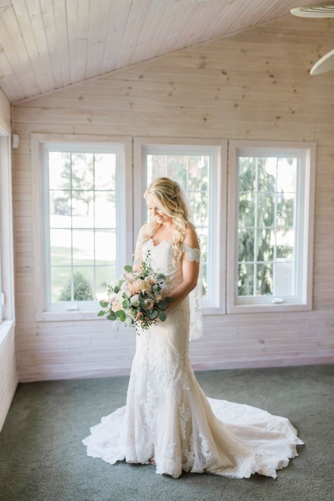 Romantic bridal portrait featuring a designer wedding gown from Aleana’s Bridal.