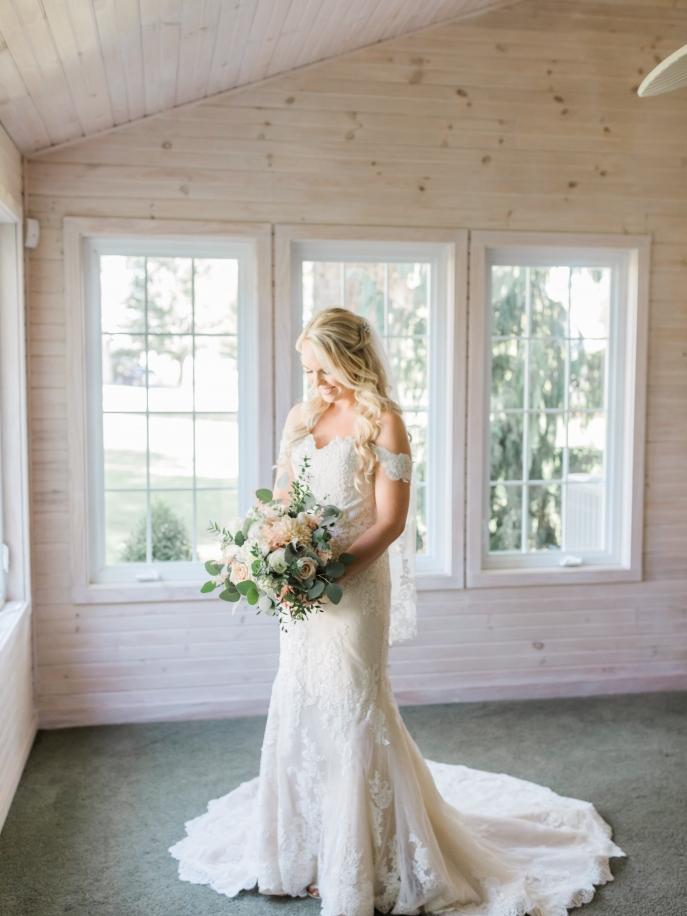 Romantic bridal portrait featuring a designer wedding gown from Aleana’s Bridal.