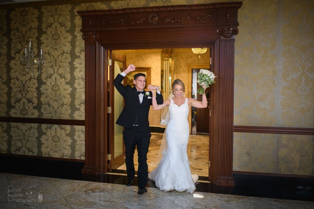 Happy bride in a classic lace wedding dress from Aleana’s Bridal