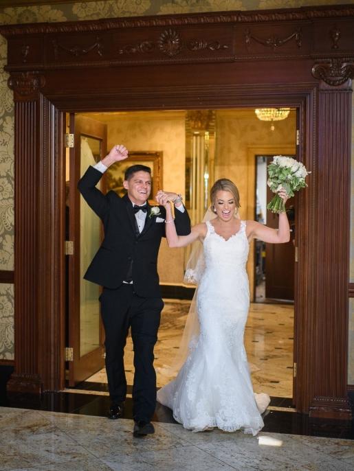 Happy bride in a classic lace wedding dress from Aleana’s Bridal