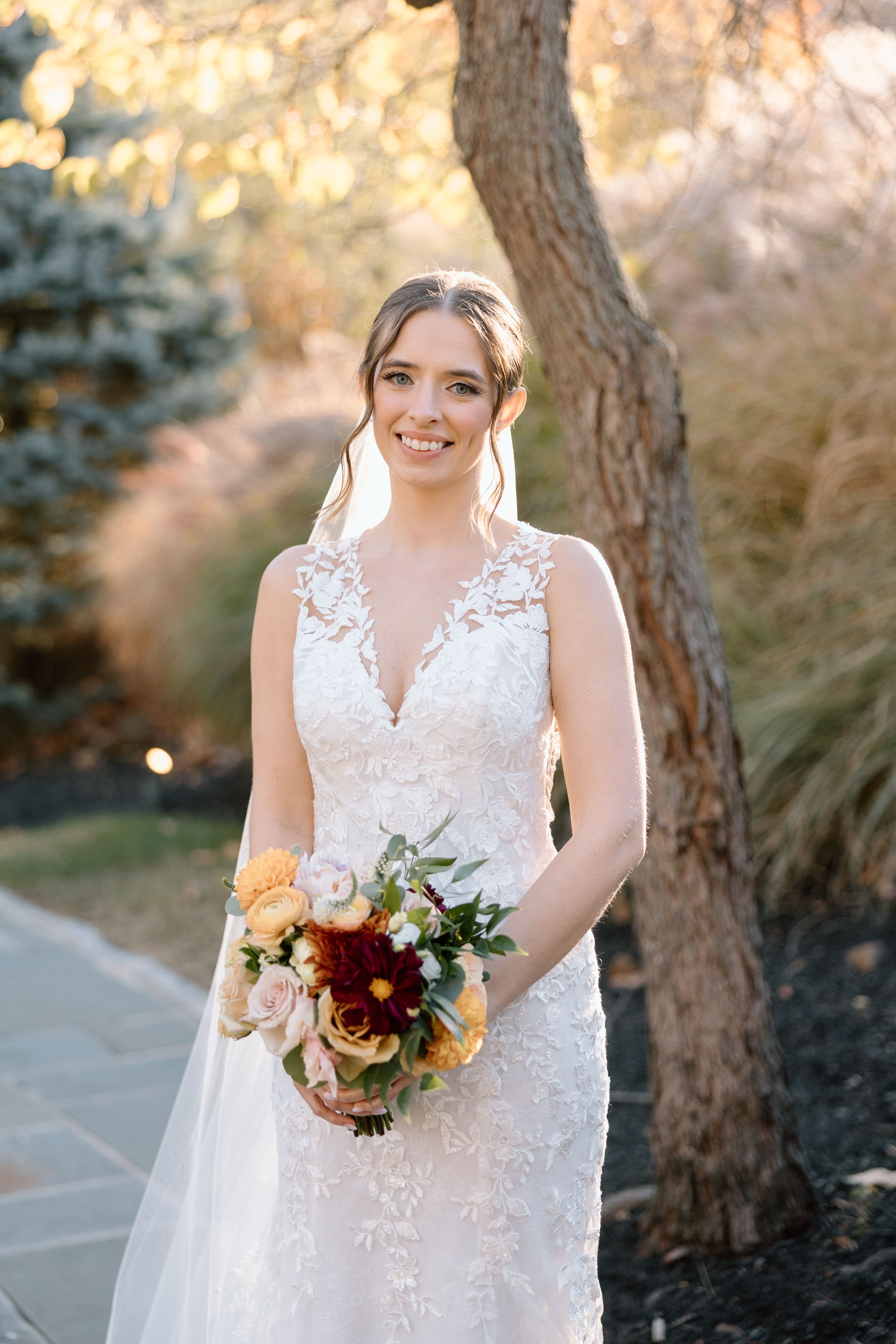 Happy bride in a beatiful lace bridal dress purchased from Aleana’s Bridal
