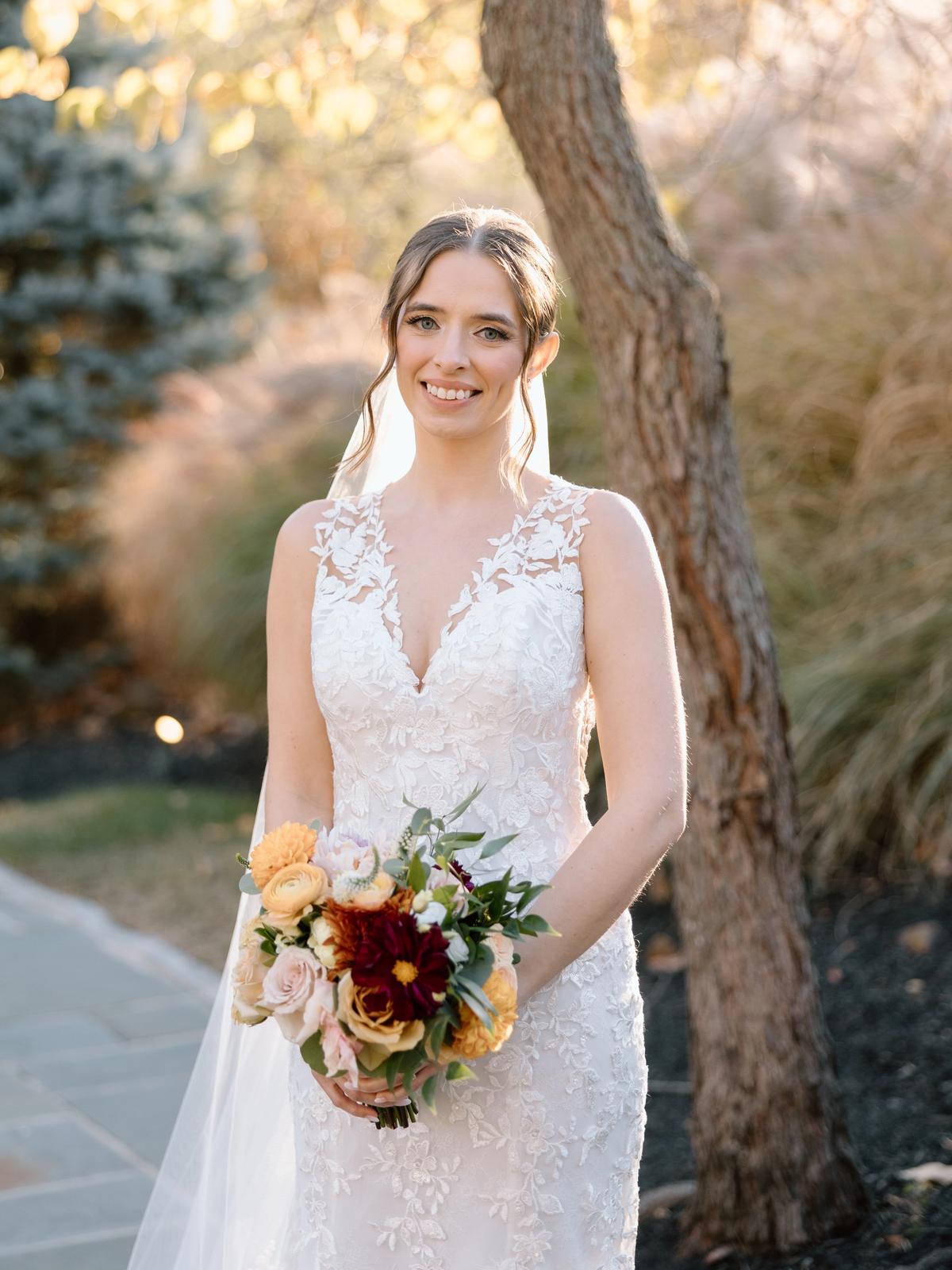 Happy bride in a beatiful lace bridal dress purchased from Aleana’s Bridal