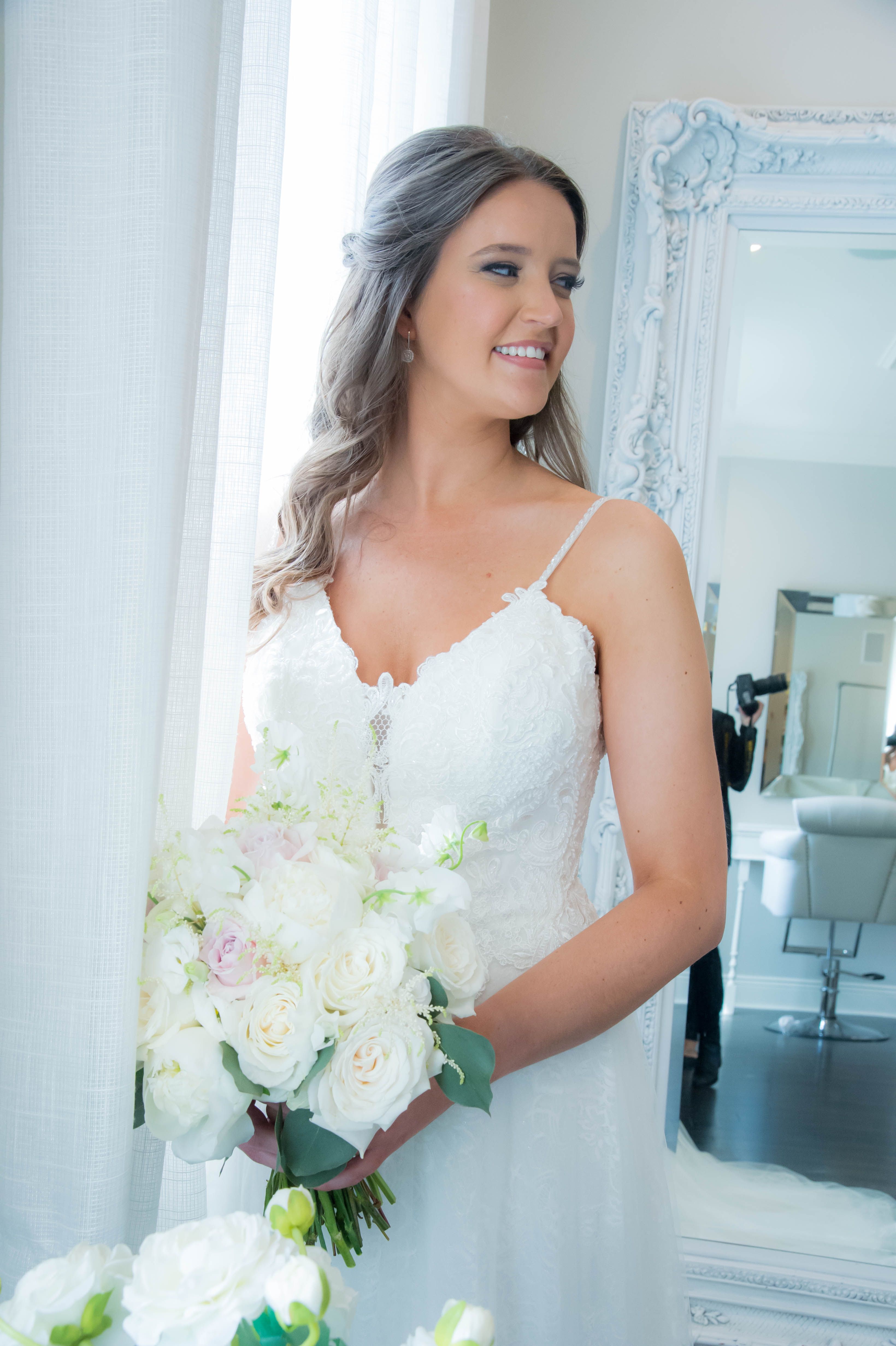 Romantic bridal portrait featuring a designer wedding gown from Aleana’s Bridal