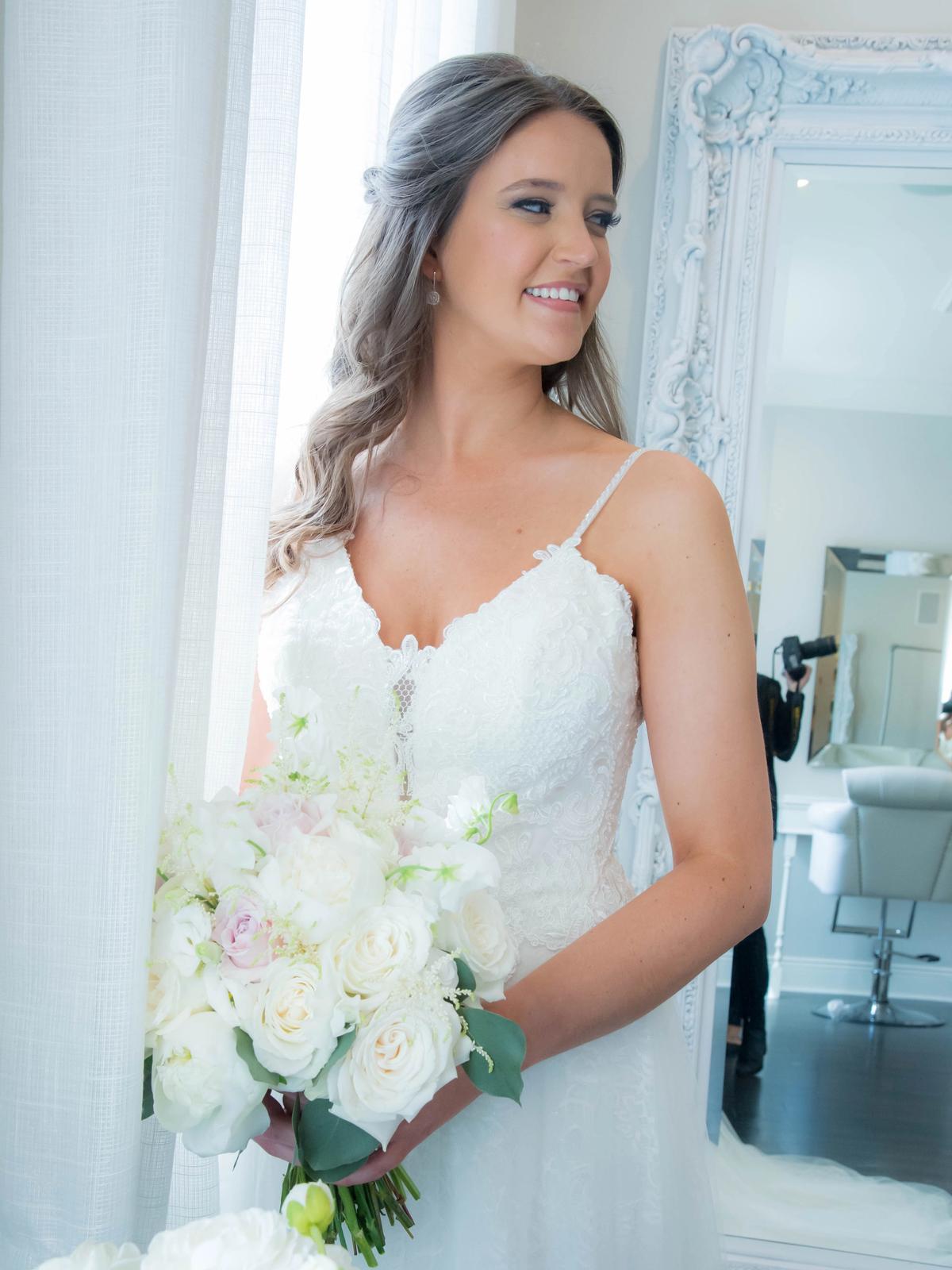 Romantic bridal portrait featuring a designer wedding gown from Aleana’s Bridal