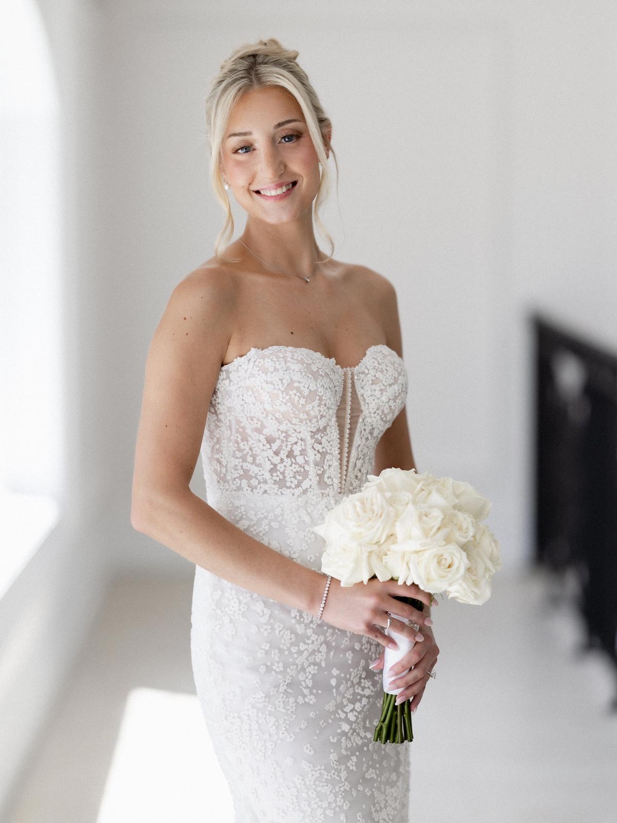 Romantic bridal portrait featuring a designer wedding gown from Aleana’s Bridal.