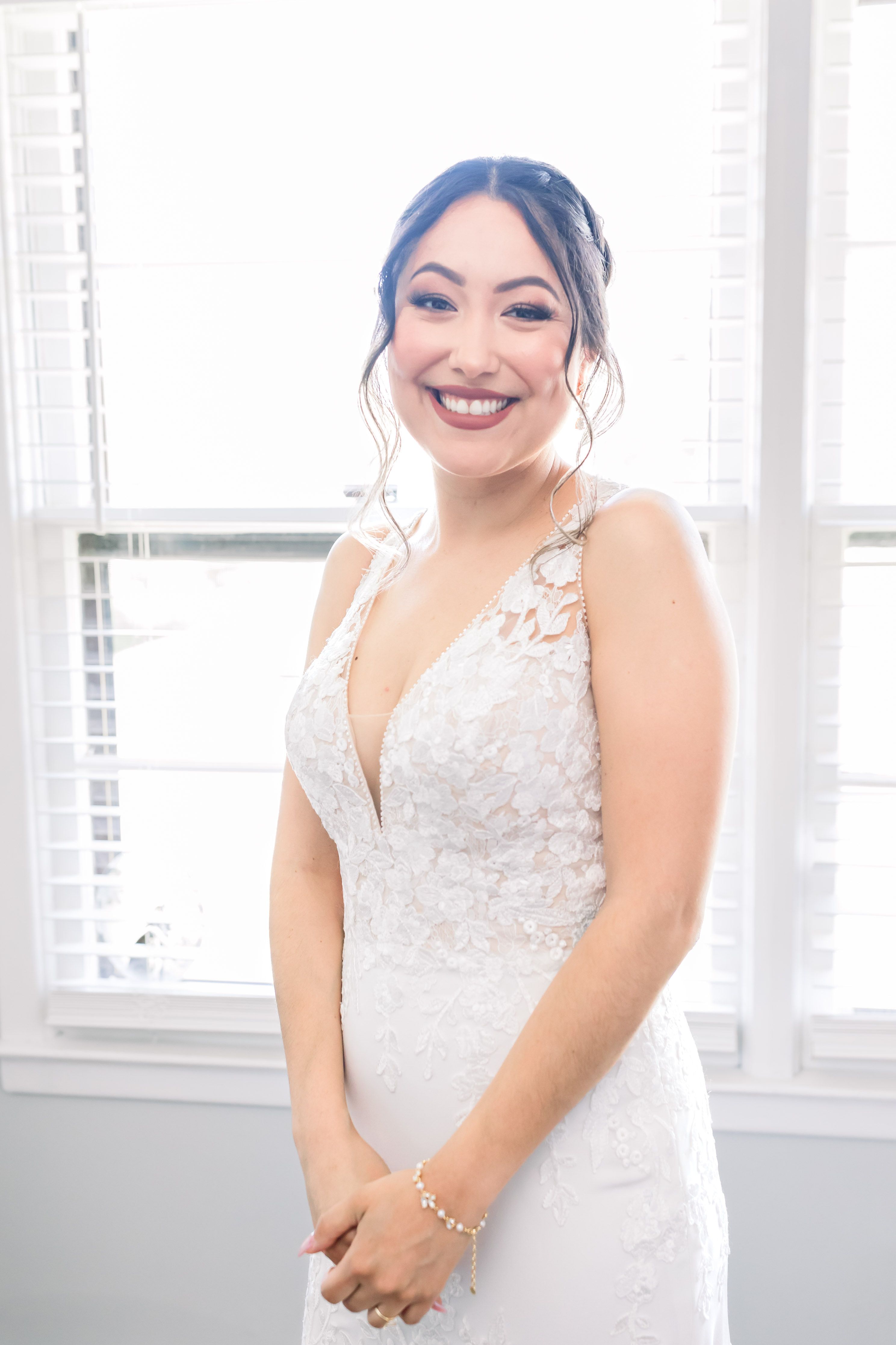 Romantic bridal portrait featuring a designer wedding gown from Aleana’s Bridal.