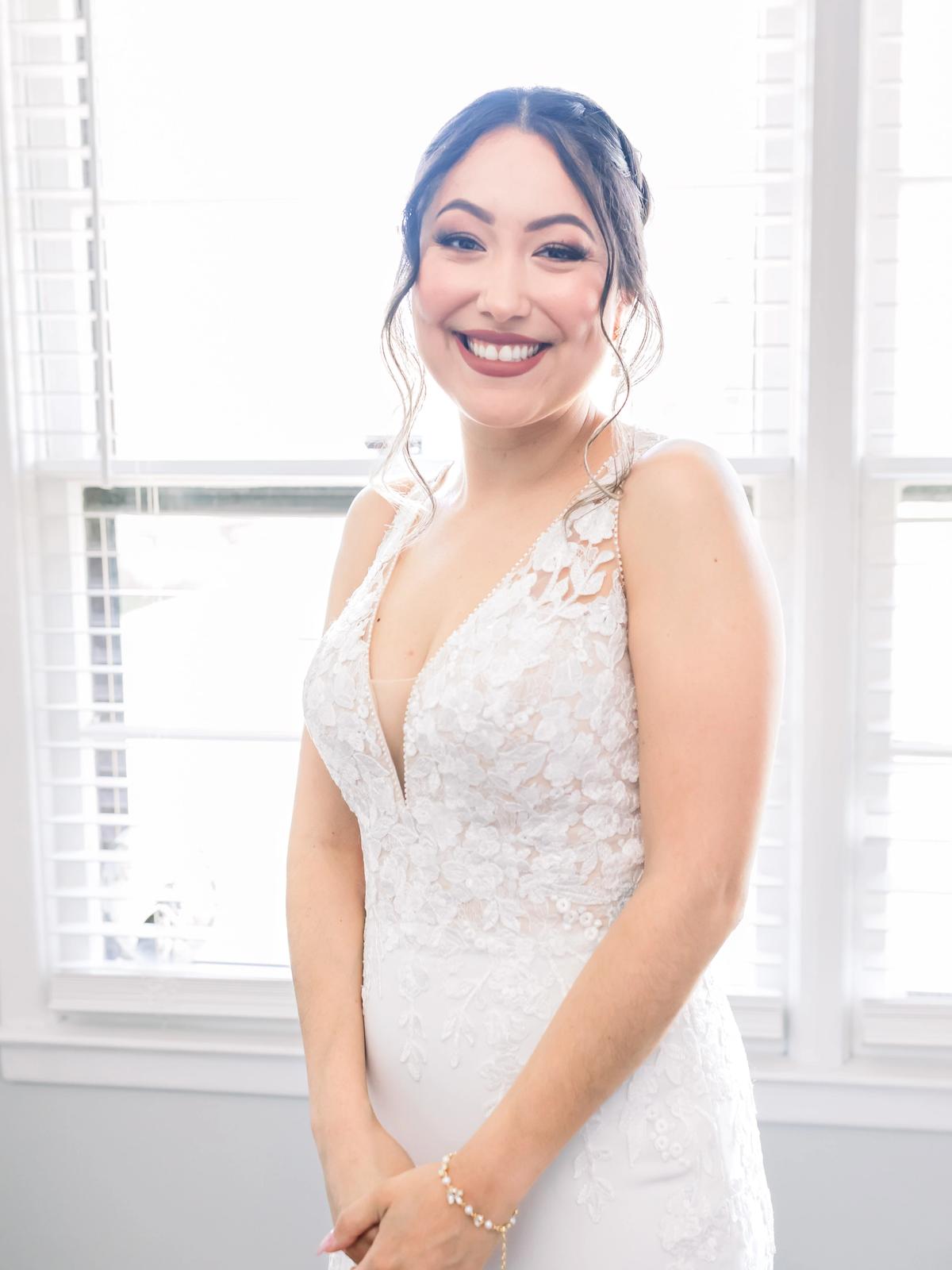 Romantic bridal portrait featuring a designer wedding gown from Aleana’s Bridal.