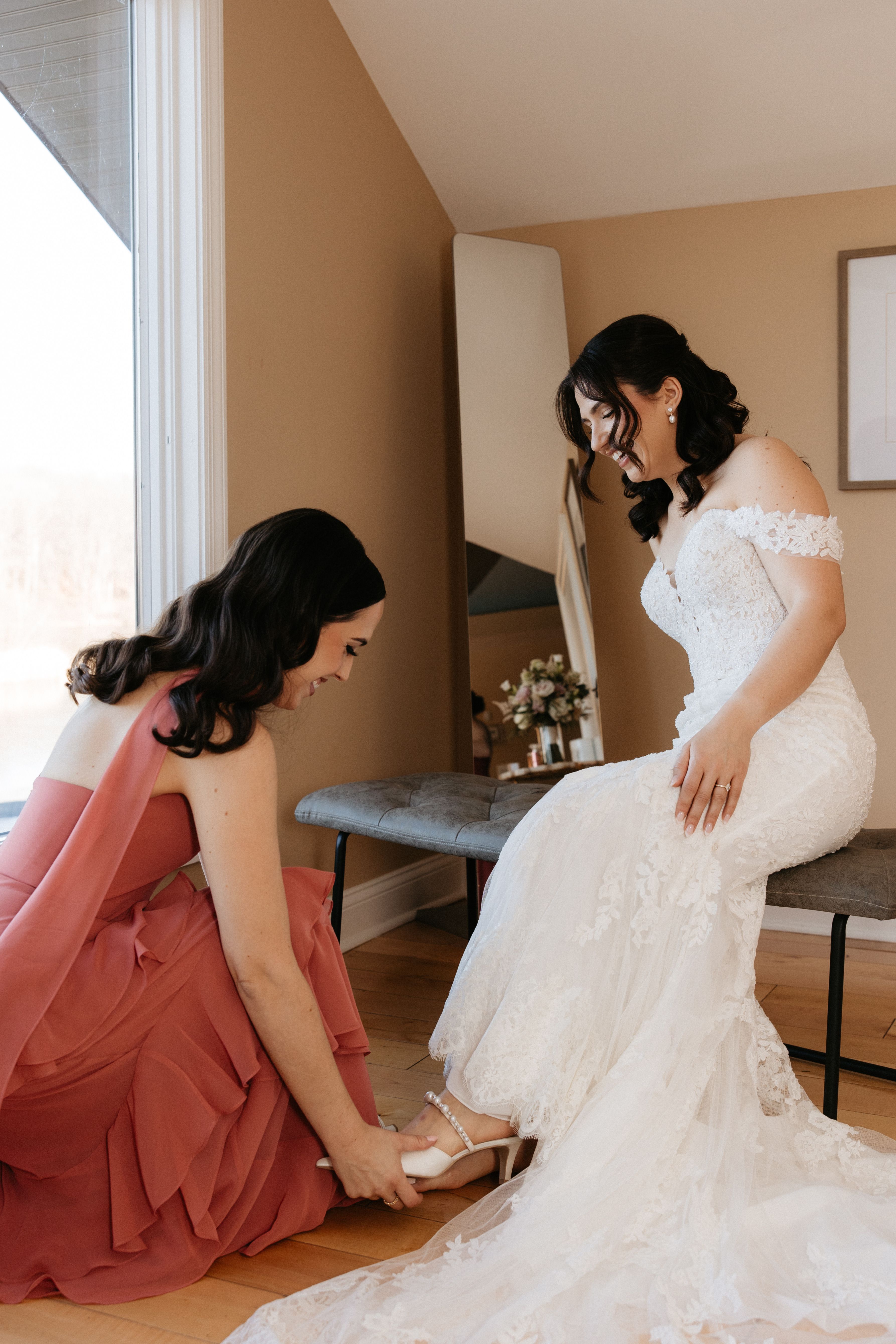 Bride wearing a fitted lace wedding gown purchased at Aleana’s Bridal.