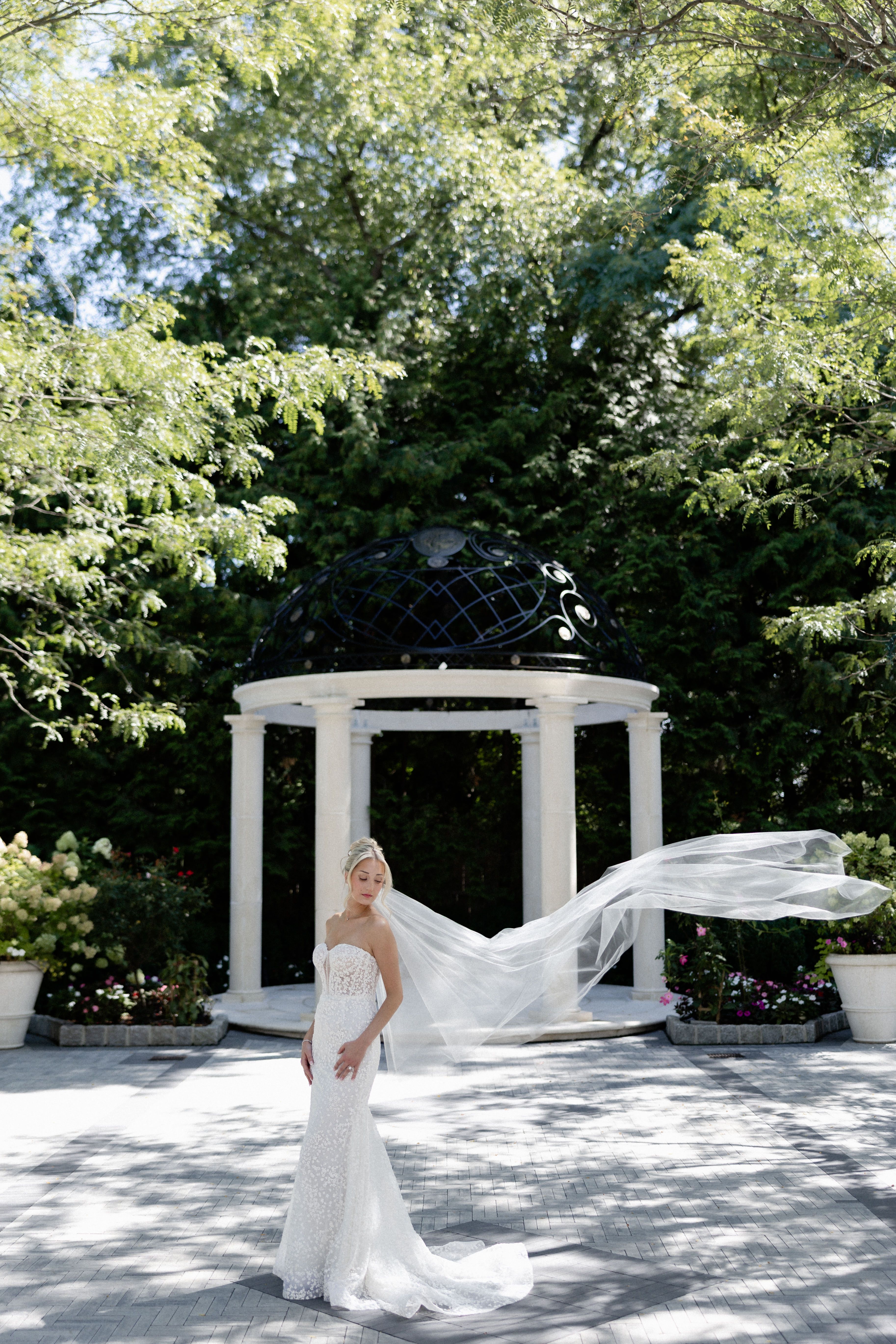 Happy bride in an elegant lace wedding dress from Aleana’s Bridal