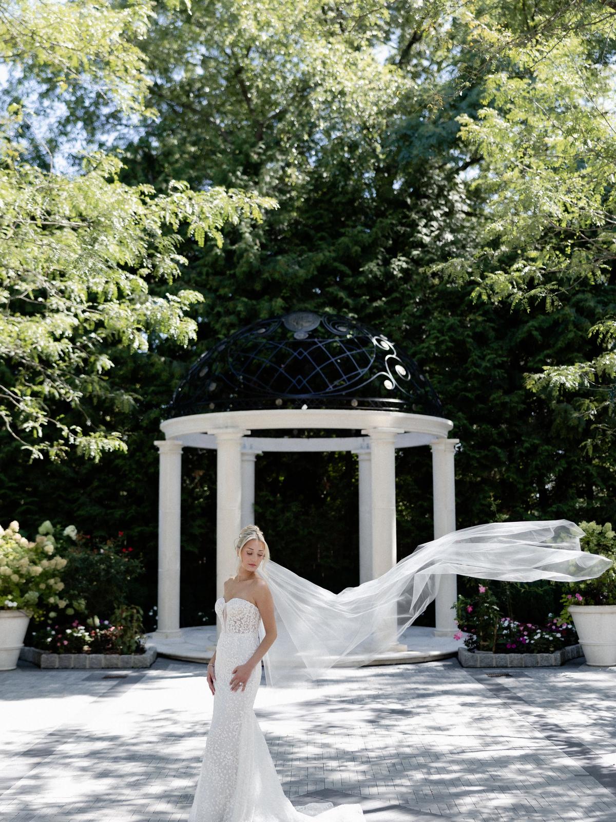 Happy bride in an elegant lace wedding dress from Aleana’s Bridal