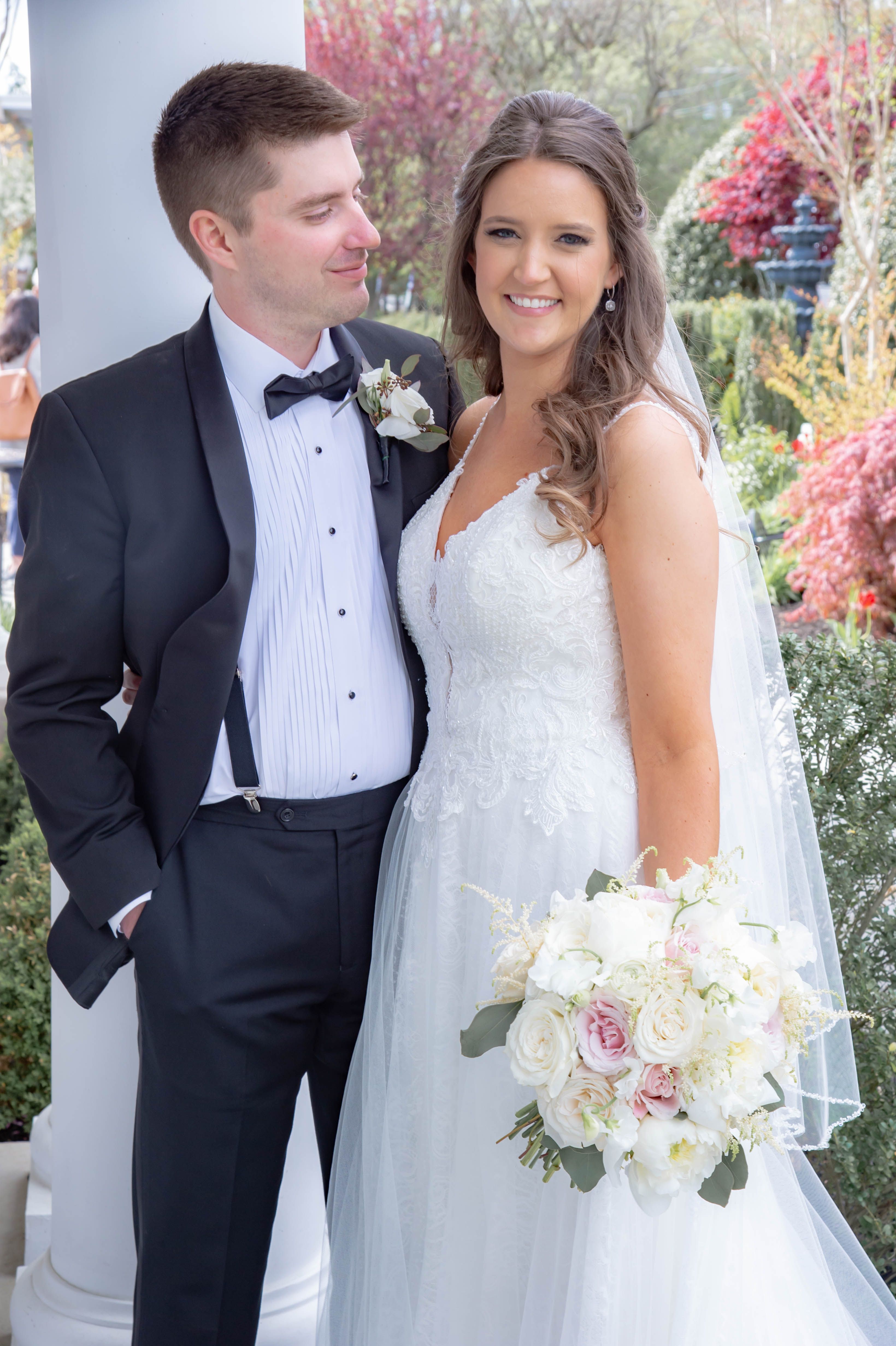Bride wearing a couture wedding dress with lace detailing from Aleana’s Bridal