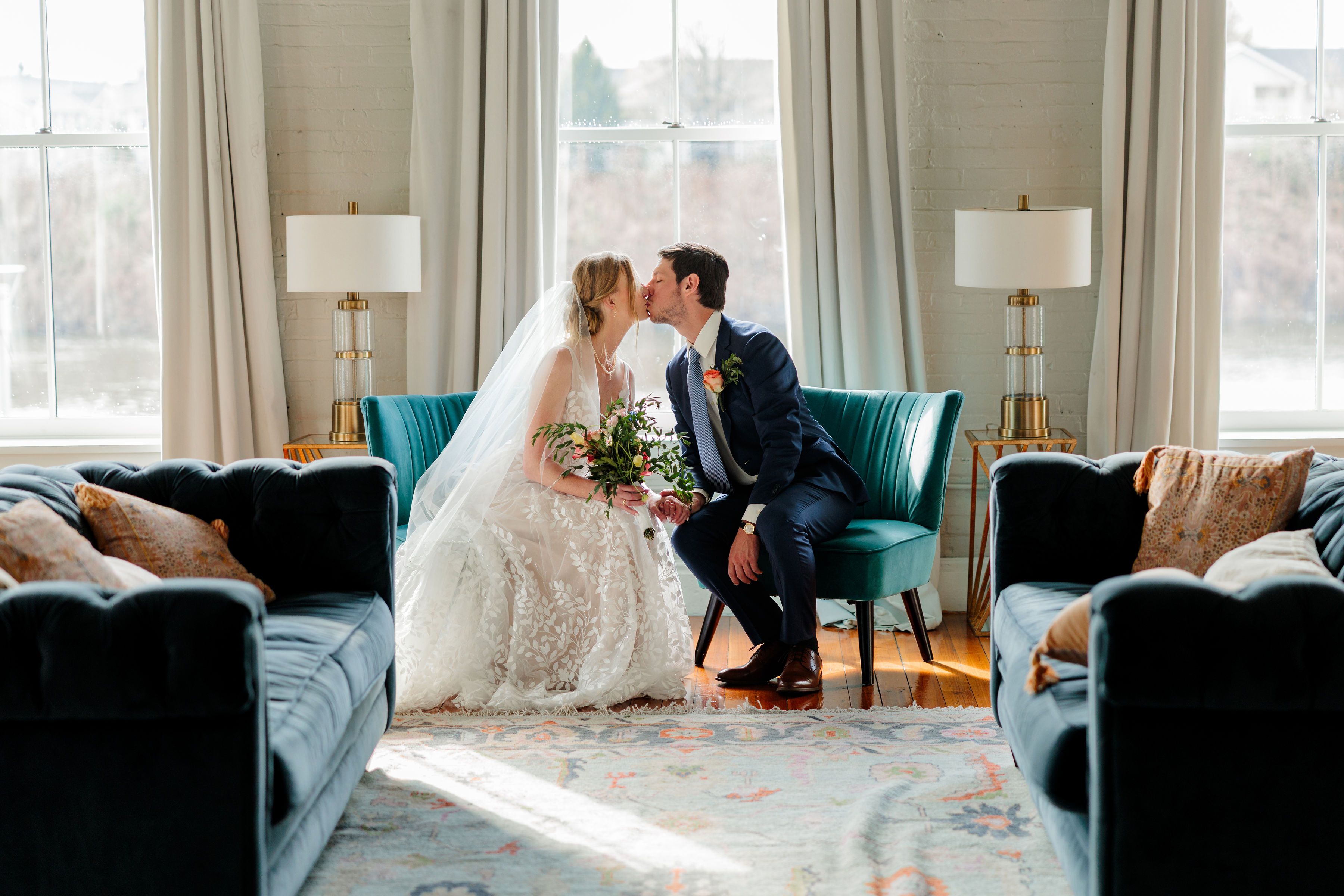 Happy bride in a classic lace wedding dress from Aleana’s Bridal