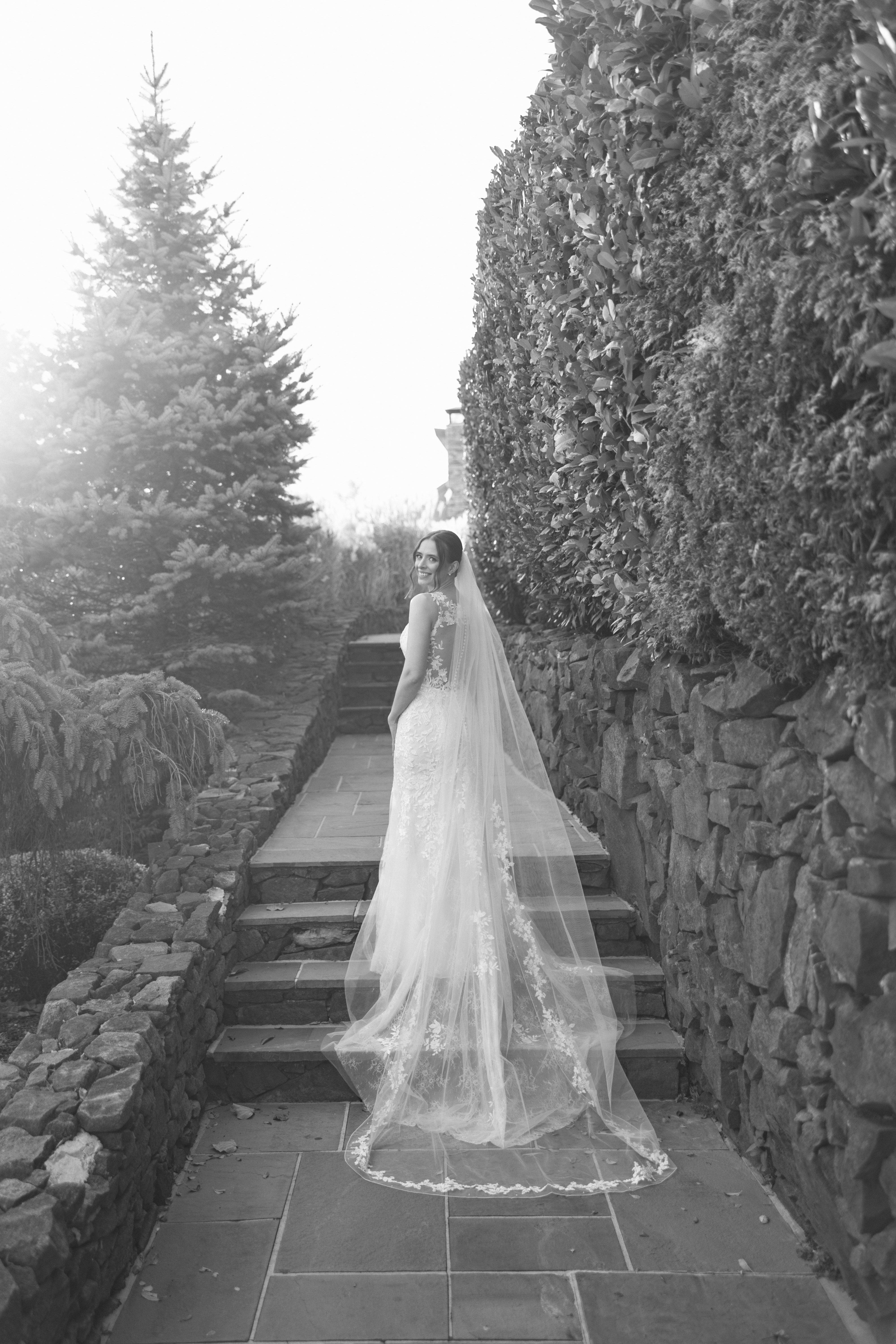 Happy bride in a lace wedding dress from Aleana’s Bridal