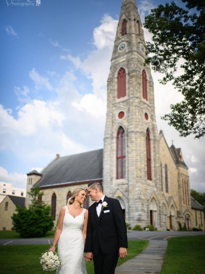 Happy bride in a elegant wedding dress from Aleana’s Bridal