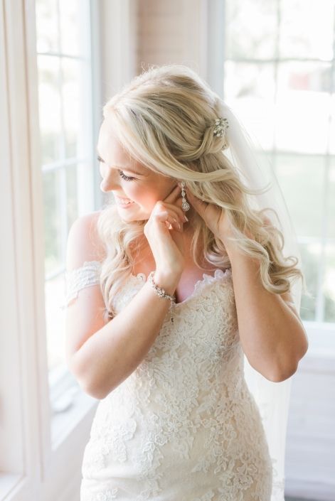 Romantic bridal portrait featuring a designer wedding gown from Aleana’s Bridal.